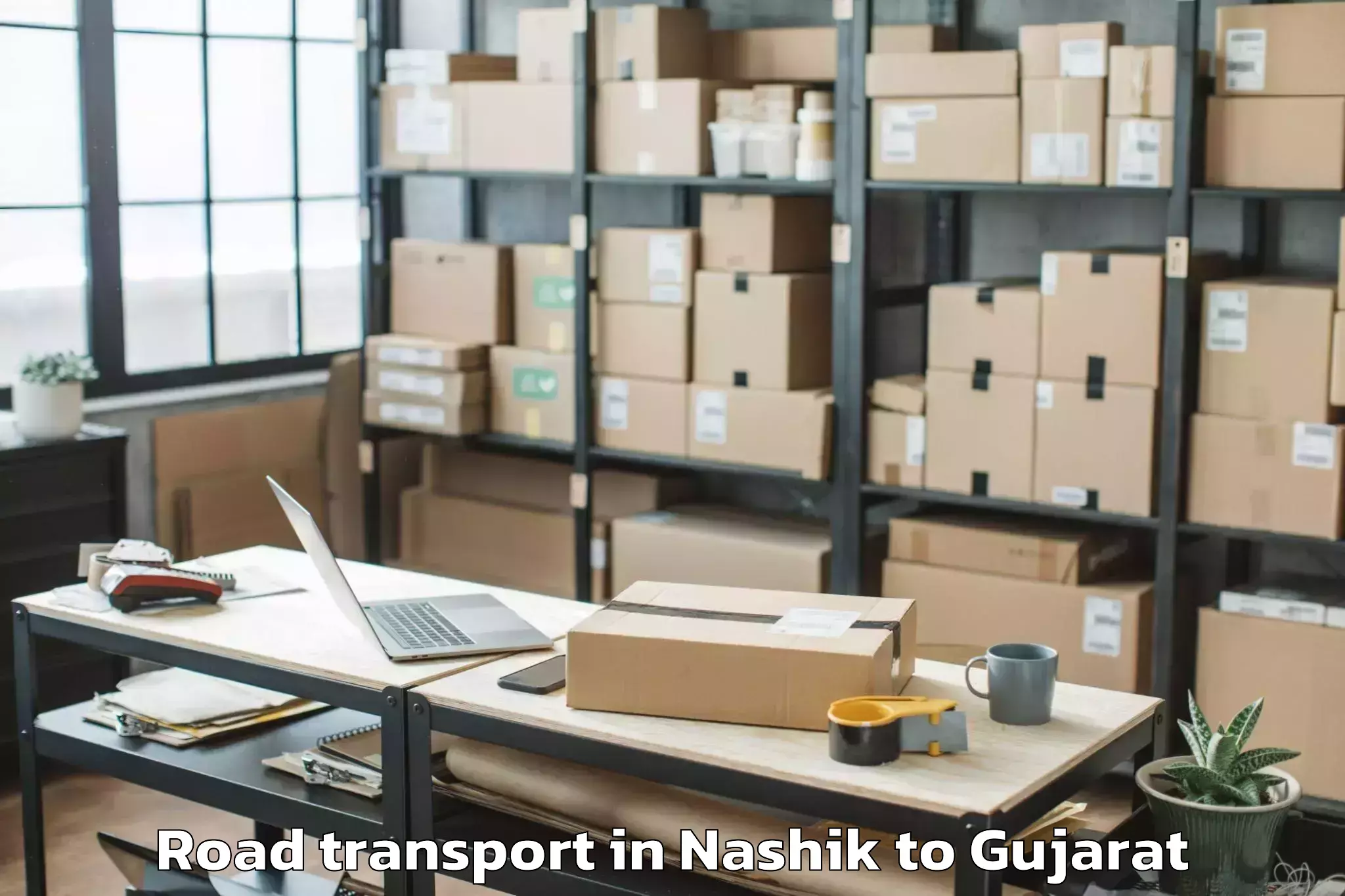 Top Nashik to Rk University Rajkot Road Transport Available